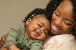 Mother and child embracing and smiling